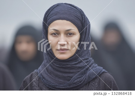 Group of women in traditional dress participate in a cultural event outdoors Group of women in traditional dress participate in a cultural event outdoors 132868418