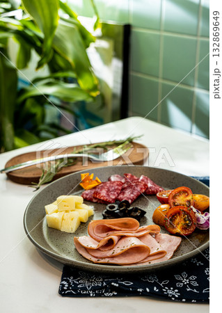 A refreshing western breakfast with cheese tomato and ham in a greenery filled cafe A refreshing western breakfast with cheese tomato and ham in a greenery filled cafe 132869649