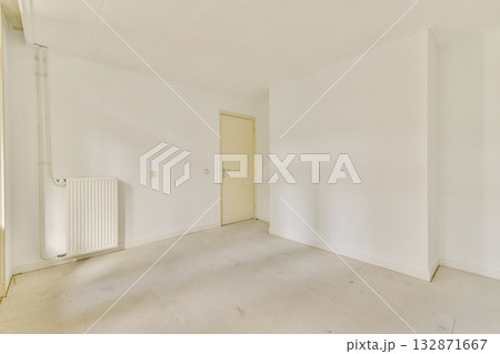 A minimalistic and clean white interior showcasing an empty room with plain walls and flooring, emphasizing simplicity and spaciousness. A minimalistic and clean white interior showcasing an empty room with plain walls and flooring, emphasizing simplicity and spaciousness. 132871667