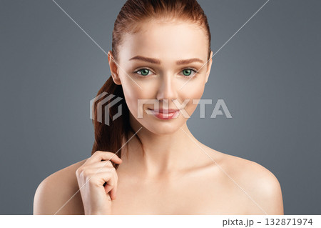 Haircare. Red-Haired Young Lady With Ponytail Hairstyle Touching Smooth Red Hair Smiling To Camera Posing Over White Studio Background. Youth Beauty Portrait, Spa Concept Haircare. Red-Haired Young Lady With Ponytail Hairstyle Touching Smooth Red Hair Smiling To Camera Posing Over White Studio Background. Youth Beauty Portrait, Spa Concept 132871974