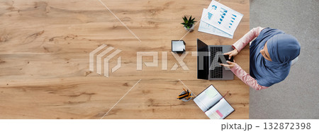 Business Communication. Top View Of Arabic Female Employee Using Smartphone And Working On Laptop While Sitting At Desk In Modern Office Business Communication. Top View Of Arabic Female Employee Using Smartphone And Working On Laptop While Sitting At Desk In Modern Office 132872398