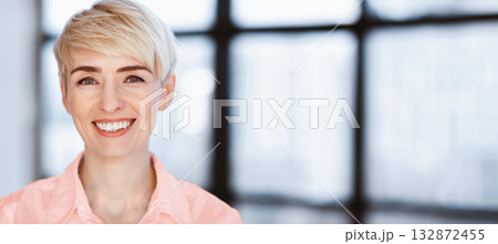 Portrait Of Happy Businesswoman Smiling Looking At Camera Posing In Modern Office. Successful Business People. Selective Focus Portrait Of Happy Businesswoman Smiling Looking At Camera Posing In Modern Office. Successful Business People. Selective Focus 132872455