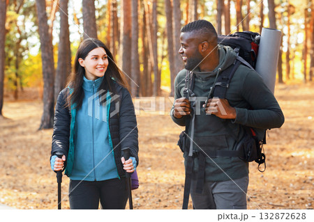 Multiracial group of young hikers having fun while backpacking at forest 132872628