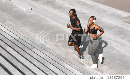 Black Man And Woman Jogging Together In Urban Park, Running Up Steps, Working Out Outdoors, Empty Space 132872984