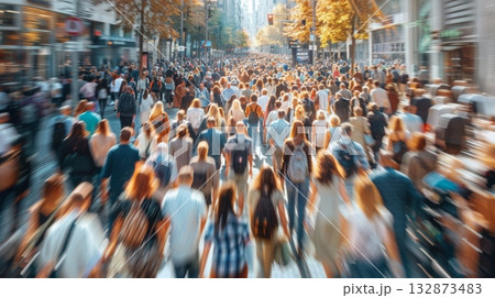 Crowd of diverse individuals walking together down a bustling city street. 132873483