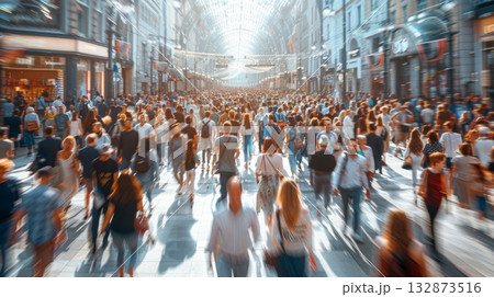 A group of individuals walking down a city street surrounded by tall buildings, urban environment. 132873516