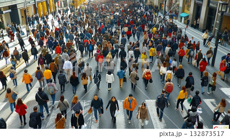 A crowd of pedestrians walking across a busy urban street, with buildings and cars in the background. A crowd of pedestrians walking across a busy urban street, with buildings and cars in the background. 132873517