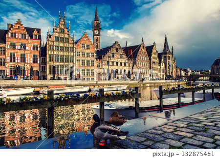Ghent city historical center, tourists boats and colorful buildings on Leie river bank, Belgium 132875481