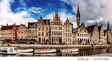 Ghent city historical center, tourists boats and colorful buildings on Leie river bank, Belgium 132875485