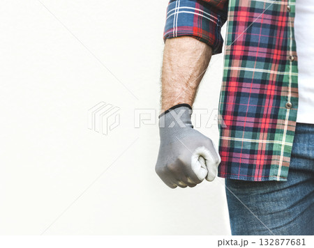 Attractive man, clenched fist and work clothes 132877681