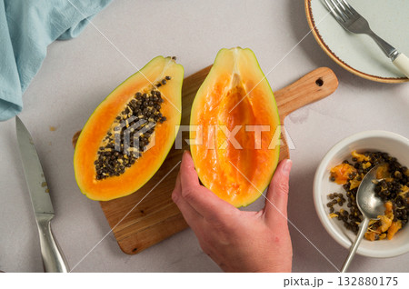 Papaya orange fruit cutted in halves, bright food photo, top view 132880175