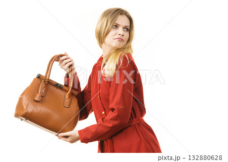 Woman protecting her handbag 132880628