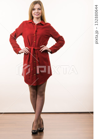 Woman wearing elegant casual red dress Woman wearing elegant casual red dress 132880644