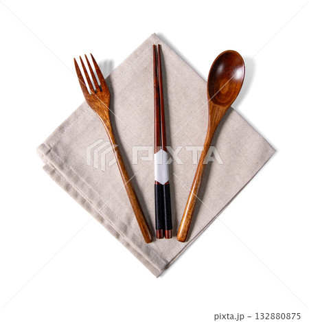 Wooden Fork Spoon Chopsticks Set On Linen Napkin White Background Wooden Fork Spoon Chopsticks Set On Linen Napkin White Background 132880875