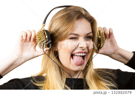 Teenage woman wearing headphones 132882079