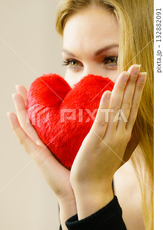 Woman holding red heart 132882091