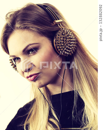 Teenage woman wearing headphones Teenage woman wearing headphones 132882092