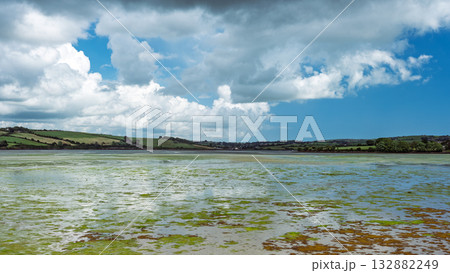 Clouds reflect softly on the water surface. 132882249