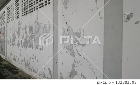 Peeling paint cracked wall concrete texture weathered surface urban decay damp stain rough plaster aged facade. Peeling paint Peeling paint cracked wall concrete texture weathered surface urban decay damp stain rough plaster aged facade. Peeling paint 132882505