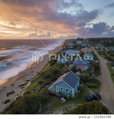 Coastal house sunset ocean beach waves drone aerial view seaside community serene 132882596