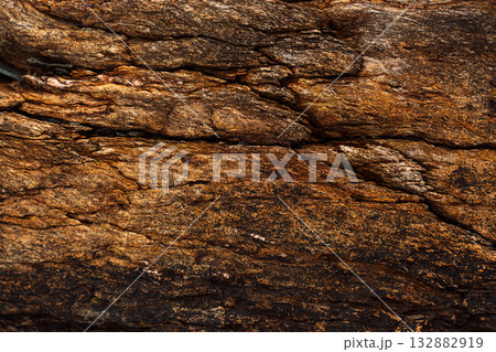 Natural rock strata forming rough textured stone background Natural rock strata forming rough textured stone background 132882919