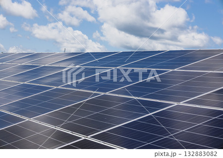 Shiny Solar Panels Under Bright Sky at Utility Scale Solar Farm for Clean Energy 132883082