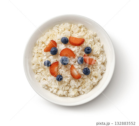 Bowl of rice flakes with berries isolated on white background, top view Bowl of rice flakes with berries isolated on white background, top view 132883552