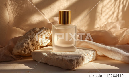 Modern fragrance packaging design with frosted glass, chic textures, and golden details for commercial use. 132884164