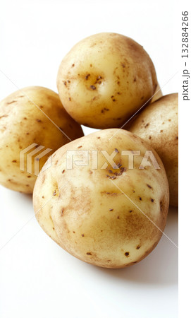Rustic raw potatoes isolated on white, with natural earthy skin texture, perfect for farm and organic food designs. 132884266