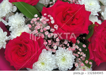 A bouquet of red roses, white chrysanthemums and small pink gypsophilas A bouquet of red roses, white chrysanthemums and small pink gypsophilas 132884945