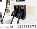 An electric vehicle charging station in an outdoor parking lot. An eco-friendly transport concept. 132885374