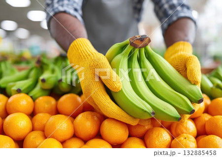 Green Bananas and Fresh Oranges in Market Hands Green Bananas and Fresh Oranges in Market Hands 132885458