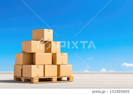 Stack of cardboard boxes on wooden pallet under blue sky Stack of cardboard boxes on wooden pallet under blue sky 132885605