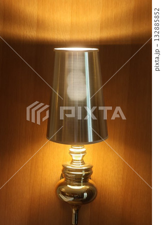 Warm Modern Table Lamp With Brushed Metal Shade On Walnut Wall For Home Decor Warm Modern Table Lamp With Brushed Metal Shade On Walnut Wall For Home Decor 132885852