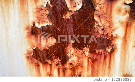 Grunge white painted metal texture with heavy vertical rust stains. Abstract industrial background. 132886089