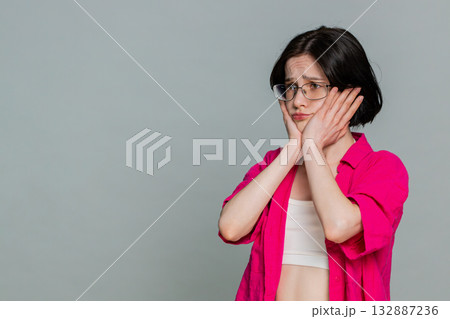 Woman sighs with disappointment covering face expressing sadness after failure or bad news reaction Woman sighs with disappointment covering face expressing sadness after failure or bad news reaction 132887236