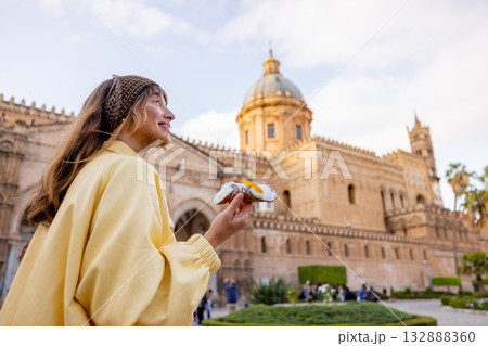 Woman Holding Cannolo near Palermo Cathedral 132888360