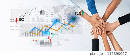 Diverse hands joining together with financial graphs and statistics symbolizing teamwork and collaboration for business success and growth analysis Scalp 132890067