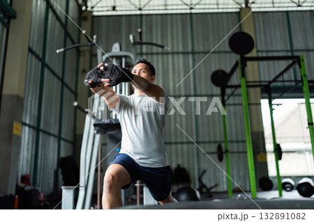 Functional Training. Man lunging with weights in gym. Functional Training. Man lunging with weights in gym. 132891082