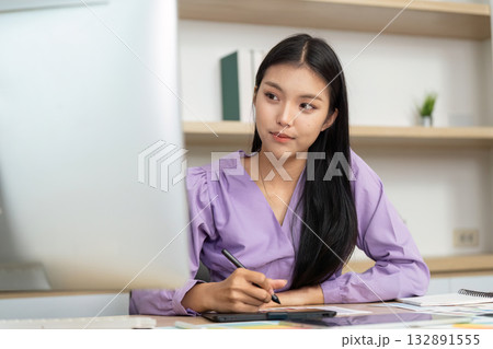Graphic Design Professional Working on Digital Tablet and Computer Graphic Design Professional Working on Digital Tablet and Computer 132891555
