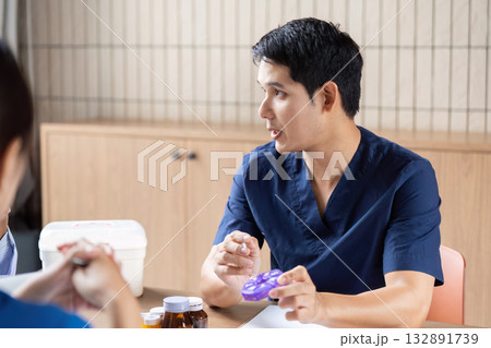 Doctor Team Meeting. Healthcare professionals discussing patient care strategies at a modern clinic. 132891739
