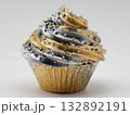 cupcake sculpture made of silver, gold metallic frosting swirl, diamond sprinkles, reflective shiny surface  132892191