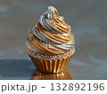 cupcake sculpture made of silver, gold metallic frosting swirl, diamond sprinkles, reflective shiny surface  132892196