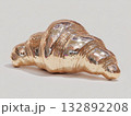 croissant forged from polished bronze, metallic flaky texture, hyper-detailed reflective surface, minimal background  132892208