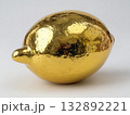 lemon sculpture, forged from bright polished gold, shiny reflective surface, minimal white background 132892221