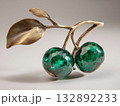 cherries sculpture forged from bronze, polished shiny surface, emerald green gemstone leaves, minimal clean backdrop  132892233
