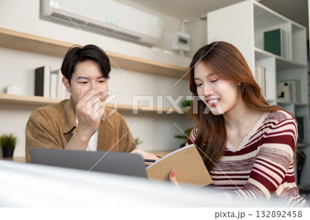 Student Collaboration and Learning. Two young adults engaged in a productive academic discussion. Student Collaboration and Learning. Two young adults engaged in a productive academic discussion. 132892458