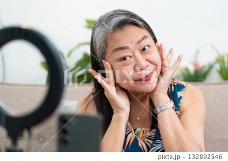 Beauty Expression and Self-Care. A woman playfully showing her skincare routine with a smile. Beauty Expression and Self-Care. A woman playfully showing her skincare routine with a smile. 132892546