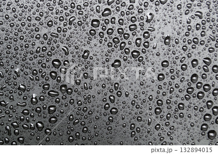Water droplets on black cover background. Suitable for design and wallpaper. Water droplets on black cover background. Suitable for design and wallpaper. 132894015