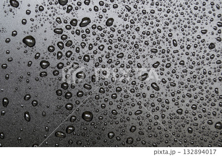 Close up of water droplets on black cover background. Suitable for design and wallpaper. 132894017